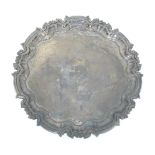 A Victorian silver visiting card tray / small salver on three scrolled feet, hallmarked London 1902,