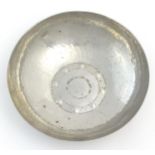 An Arts and Crafts Lakeland Rural Industries Borrowdale Staybrite hammered dish with roundel detail.