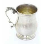 A silver christening mug hallmarked London 1906, maker Goldsmiths & Silversmiths Co. Ltd. Approx.