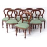 A set of eight late 20thC / early 21stC mahogany balloon back dining chairs in the Victorian
