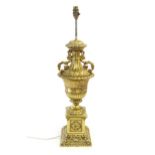 A gilt metal table lamp of twin handled urn form. Approx. 28" high Please Note - we do not make