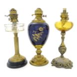 Three assorted 19thC and later oil lamps, one with Duplex burner. Largest approx. 17" high