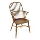 A late 18thC / early 19thC elm and yew stick back Windsor chair, stamped 'Hubbard, Grantham'. This