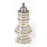 A silver pepper of octagonal form, hallmarked Chester 1909, maker Haseler Brothers. Approx. 3 1/4"