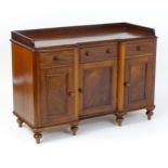 A Victorian mahogany sideboard / dresser base with a raised upstand above an inverted breakfront top