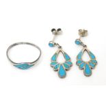 A silver ring set with turquoise detail, together with drop earrings. Ring size approx. M 1/2. (2+1)