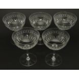 A set of 5 glass champagne coupes with cut decoration 4 1/2" high Please Note - we do not make