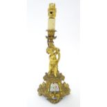 A Continental cast bronze and gilt metal table light with Sevres style hand painted panel surmounted