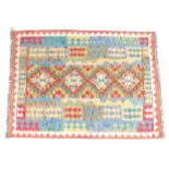 Carpet / Rug: An Anatolian Kilim with bright geometric borders and medallions. Approx. 68 1/4" x