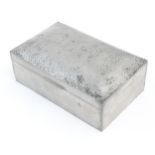 An Arts & Crafts Tudric pewter cigarette box with hammered hinged lid and cedar lining. Marked under