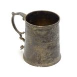 A 19thC silver christening mug of tankard form, hallmarked London 1831, maker Joseph Angell I & John