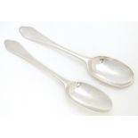 Two Queen Anne silver dog nose spoons with plain rat tail bowls and engraved armorials to handles,