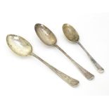 Three assorted silver spoons comprising a Victorian tablespoon with rat tail to bowl, hallmarked