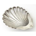 A Victorian silver butter dish of shell form, hallmarked Birmingham 1887. Approx. 5" wide Please