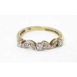 A 9ct gold ring set with cubic zirconia. Ring size approx K 1/2 Please Note - we do not make