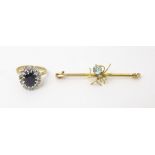 A 9ct gold ring set with central blue stone bordered by diamond together with a 9ct gold brooch
