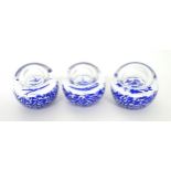 Three Caithness glass paperweights from the Blue and White Treasure series by Helen MacDonald titled