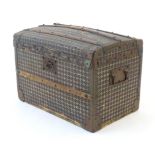 An early 20thC child's wood bound travelling trunk with domed top, twin handles and stud detail.