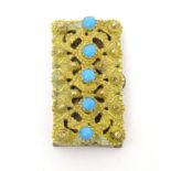 A Victorian gilt metal buckle / clasp set with turquoise cabochon decoration. 1 1/2" long Please