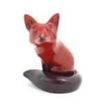 A Royal Doulton flambe model of a seated fox. Marked under. Approx. 4" high Please Note - we do