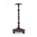 A Victorian treen turned wig stand on a tripod base with three squat bun feet. Approx. 12 3/4"