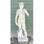 A 20thC composite stone garden statue of a Classical male figure, after Michelangelo's David.