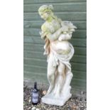 A 20thC composite stone garden statue modelled as a Classical maiden personifying Autumn /