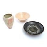 Three items of studio pottery comprising a bowl with a pink glaze and incised decoration by Pearsons