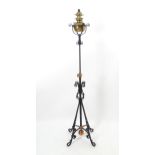 An Arts & Crafts wrought iron, copper and brass adjustable height standard lamp with pendant counter