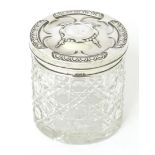 A cut glass dressing table jar with embossed silver lid, hallmarked Birmingham 1913, maker Henry