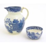 A pearlware blue and white jug decorated with chinoiserie detail with figures, bridge, pagodas, etc.
