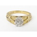 A 9ct gold diamond solitaire ring. Ring size approx. L 1/2 Please Note - we do not make reference to