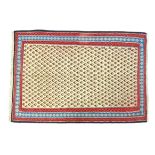 Carpet / Rug : A Senneh Kilim the cream decorated with repeating floral motifs within red and blue