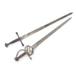 Militaria / Arms & Armour : two 20thC Spanish swords, comprising a Colada (with 33 3/4" blade,