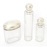 Three glass dressing table jars comprising two hallmarked Birmingham 1920, maker Wilmot