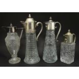 Four assorted claret jugs with silver plate mounts. Tallest approx. 12" high, shortest approx. 8 1/