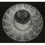 A cut crystal dish with eagle decoration. 12" diameter Please Note - we do not make reference to the