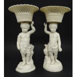 Two Copeland parian ware / bisque centrepieces modelled as a putti supporting a reticulated