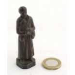 A French bronze model of Saint Benedict Joseph Labre holding a rosary. Titled to base B. Benoit