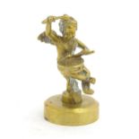 A Victorian gilt metal hand seal top / handle modelled as a putto / cherub playing a drum. Approx.