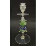 A glass candlestick with floral detail to stem in the Venetian style. Approx. 11" high Please Note -