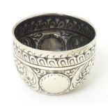 A small Victorian silver bowl with embossed decoration, hallmarked London 1882, maker Charles Stuart