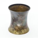 A silver beaker of waisted form, hallmarked Sheffield 1908, maker Atkin Brothers Ltd. and stamped