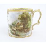 A 19thC English Derby style mug with floral and foliate gilt detail and hand painted landscape