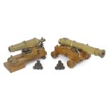 Militaria: two scale model miniature brass naval desk cannon with wooden bases and stacked balls,