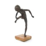 A 20thC bronze sculpture depicting a model of a boy with a raised leg, in the style of Edgar