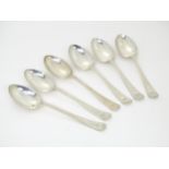 A set of six silver dessert spoons with engraved bright cut decoration to handles, hallmarked
