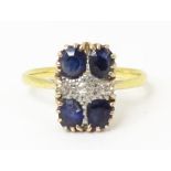 An 18ct gold ring set with sapphires and diamonds. Ring size approx M Please Note - we do not make
