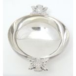 A Queen Elizabeth II Scottish silver twin handled quaich with thistle decoration to handles,