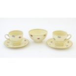 A quantity of Clarice Cliff tea wares with floral decoration and gilt highlights, comprising two tea
